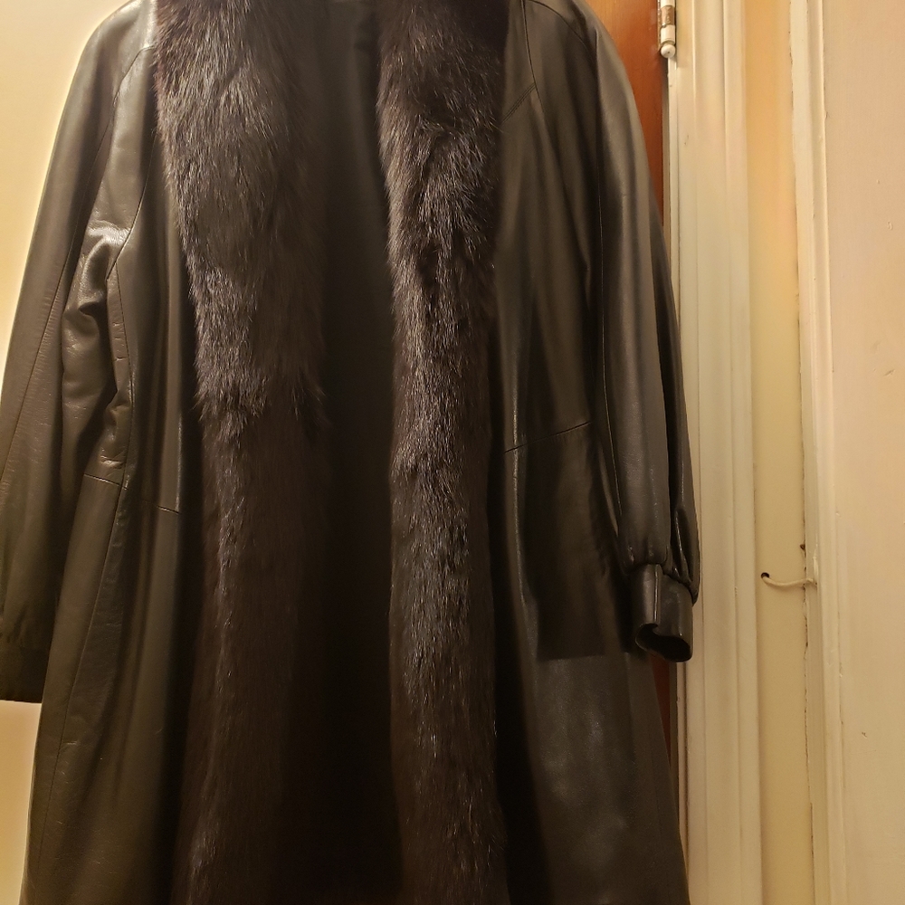 Leather jacket with fur collar